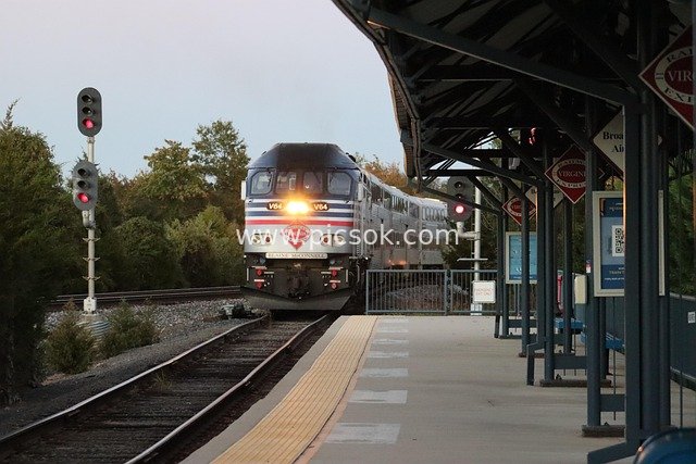 Commuter Train Arriving at Station Platform at Dusk