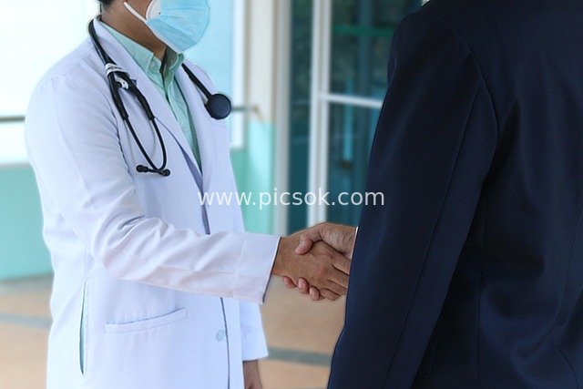 Doctor Shaking Hands with Business Professional: Trustful Moment in Medical Scene