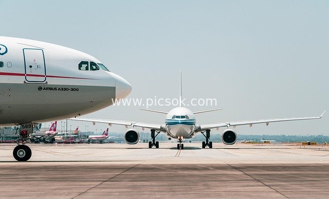 Civil Airliners Docked at Airport Apron - Real Shot of Air Transport Scene