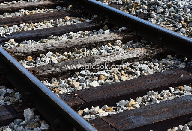 Natural Traffic Scene of Outdoor Railway Tracks, Wooden Sleepers and Ballast
