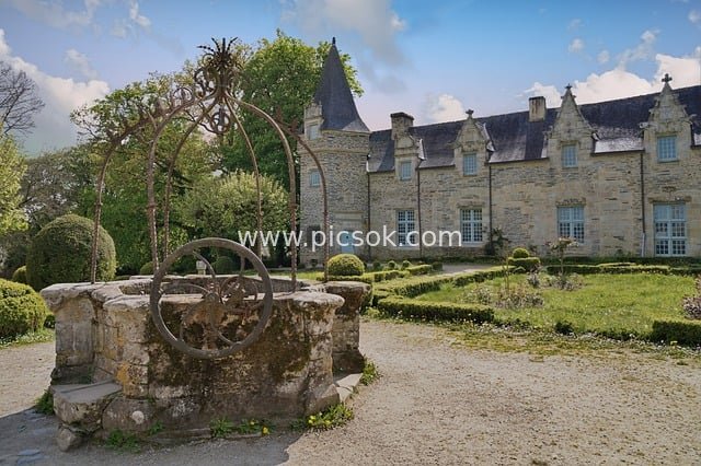 Historical Landscape Image of a Stone Well in a European Castle Courtyard
