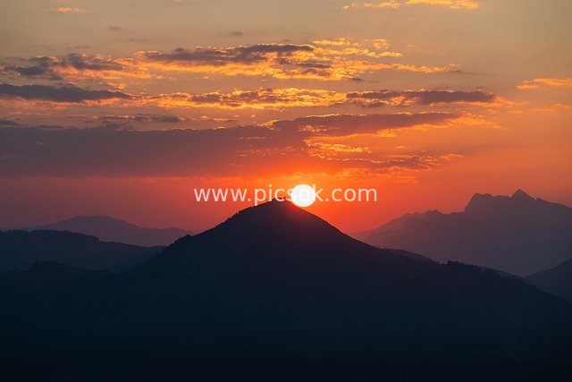 Mountain Sunrise with Orange-Red Sky Natural Landscape Wallpaper
