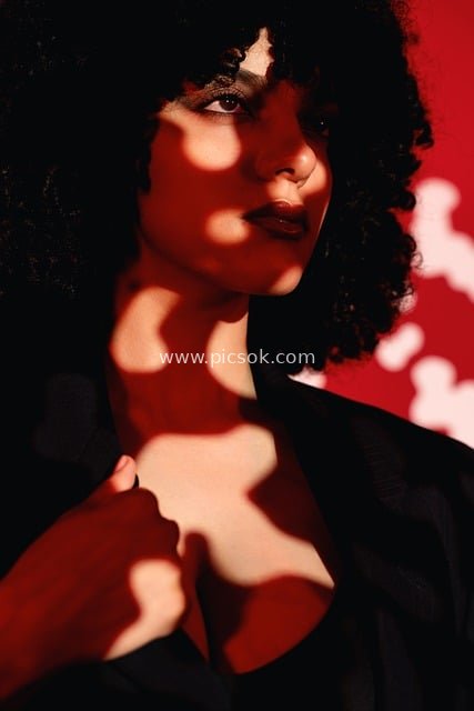 Artistic Light & Shadow Fashion Model Portrait: Confident Black Curly Hair Look