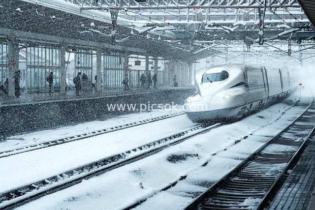 Winter Scene at a Japanese Station: High-Speed Train Speeding Through Snow