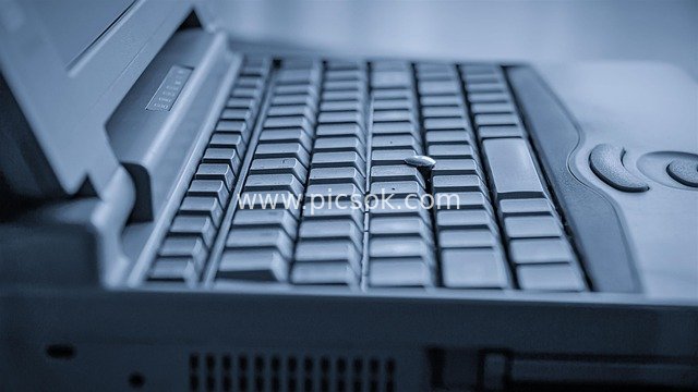 Close-up of Vintage Laptop Keyboard – Nostalgic Computer Hardware Asset