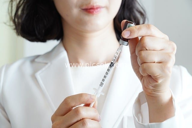 Medical Staff Operating Syringe at Korean Medicine Clinic - Traditional Medicine Scene