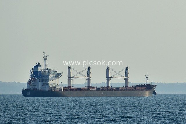 Large Cargo Ship on Open Blue Sea – Maritime Trade Transportation Scene