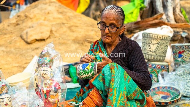 Scene of an Indian Female Artisan Creating Traditional Ceramic Crafts
