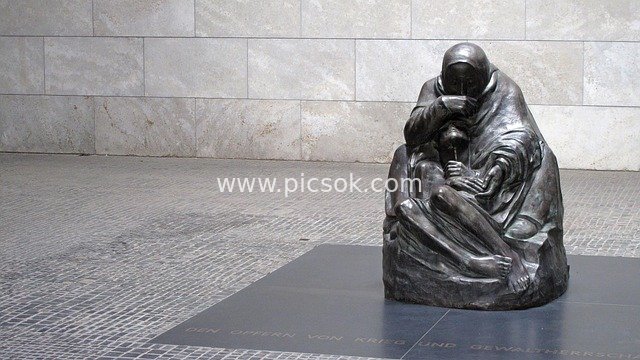 Berlin Sculpture on Debt and Forgiveness: Sad Figure Statue