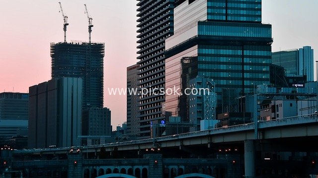Urban Architectural Complex at Dusk: Elevated Road and Under-Construction High-Rises
