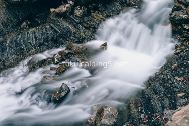 Long-Exposure Mountain Stream: Silky Flow & Rocky Natural Sanctuary