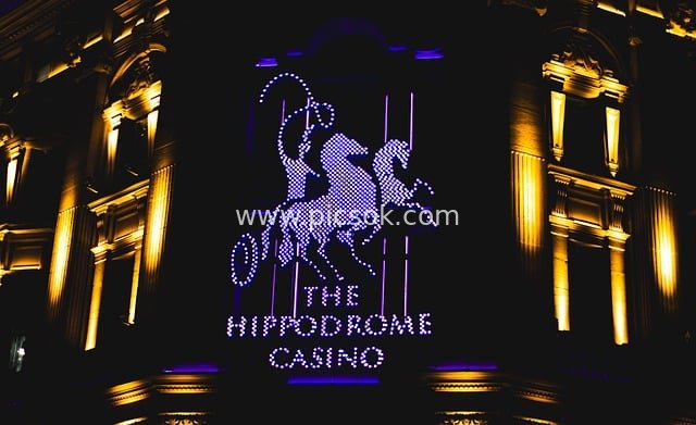 Night View of Hippodrome Casino London: Building with Colorful Horse Logo