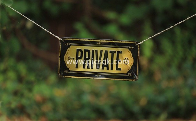 Private Exclusive Warning Sign with Green Natural Background