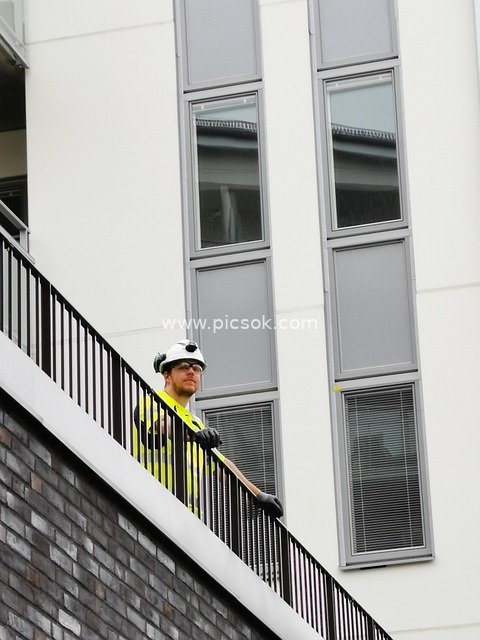 Construction Worker Wearing Safety Helmet Inspecting Construction Facilities