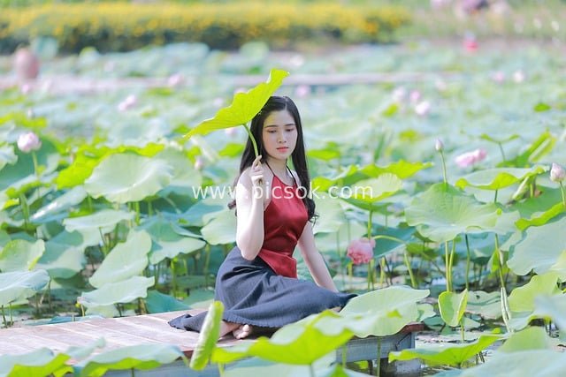 Red-Clad Model Portrait in Lotus Pond: Fresh Natural Portrait Photography