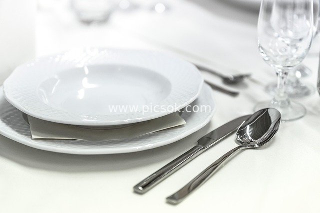 Elegant White Table Setting with Fine Tableware for Wedding Banquet