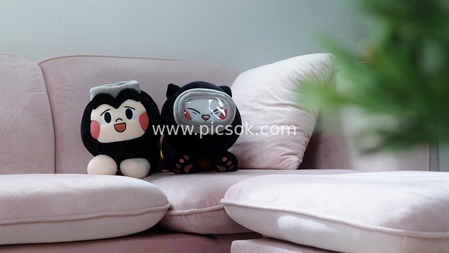 Cute Busan Haenyeo-Themed Plush Dolls on Pink Sofa