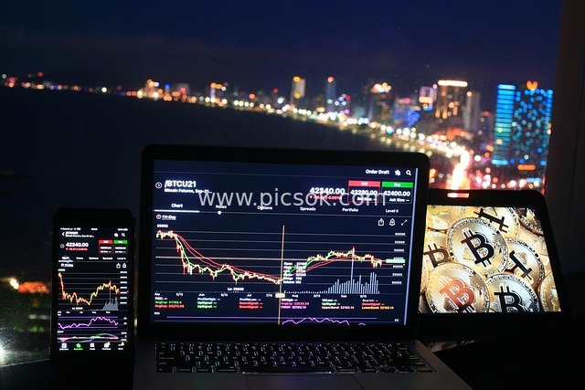 Bitcoin Cryptocurrency Trading Scene Against a Night Cityscape