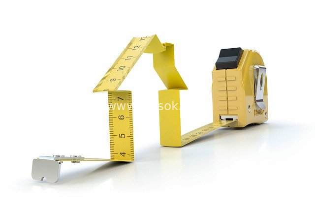 Concept Image of Yellow Tape Measure Formed House for DIY Renovation Measurement