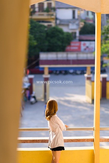 Portrait of a Vietnamese Schoolgirl from the Back, Afternoon Street Scene