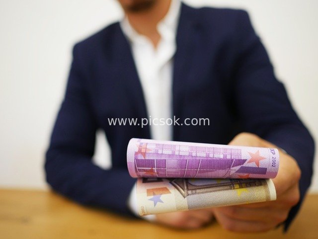 Elite Business Professional Holding Euro Cash in Financial Wealth Business Scene