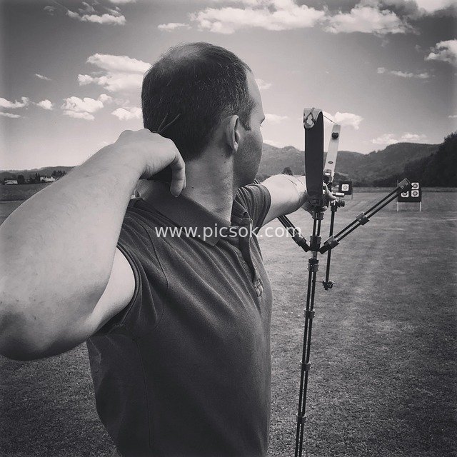 Outdoor Archery: A Moment of Focused Bow Holding and Target Aiming
