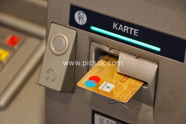 Scene of Inserting a Bank Card into an ATM for Financial Services