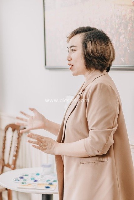 Professional Woman Hosting a Meeting & Delivering a Speech in a Business Collaboration Scene