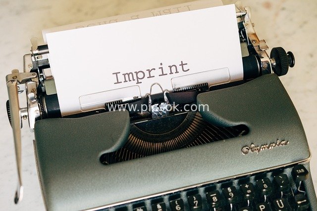 Creative Business Material with 'Imprint' Typed on a Vintage Typewriter