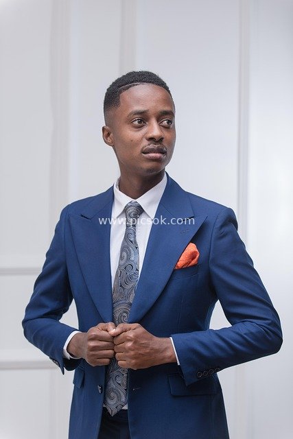 Portrait of a Businessman in Blue Suit with Orange Pocket Square