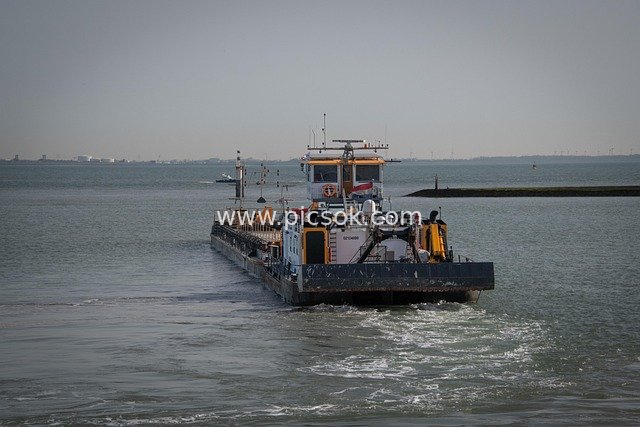 Pusher Boat Navigating the Sea: Industrial Water Transport Scene