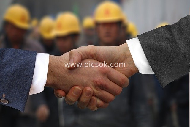 Business Handshake Collaboration: Agreement Reached, Witnessed by Engineering Team