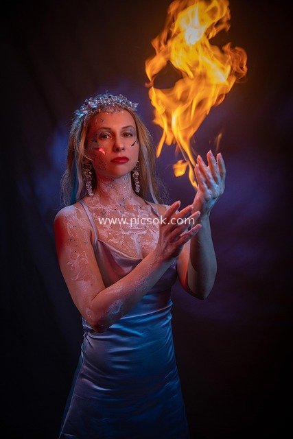 Artistic Portrait of a Blonde Woman Performing a Magical Fire Show