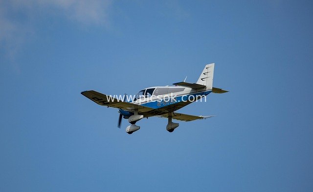 Light Private Plane Soaring in the Blue Sky