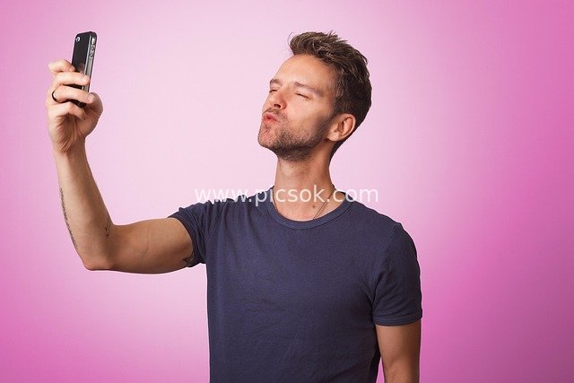 Man Taking Kissing Selfie for Dating & Social Media