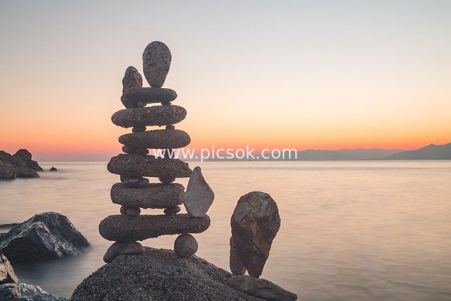 Stone Balancing Art by the Seaside at Sunset & Serene Ocean Views