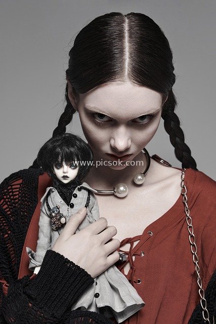 Gothic Dark Style Model Holding a Creepy Doll | Dark Fashion Photoshoot