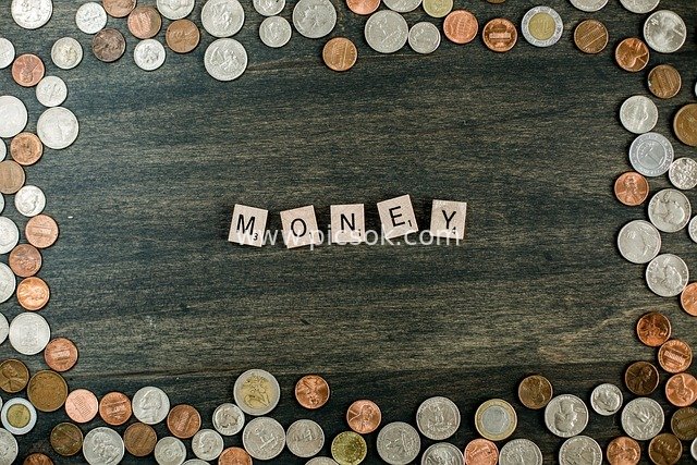 Creative Financial Composition: Euro Coins Surrounding Letter Tiles Spelling 'MONEY'