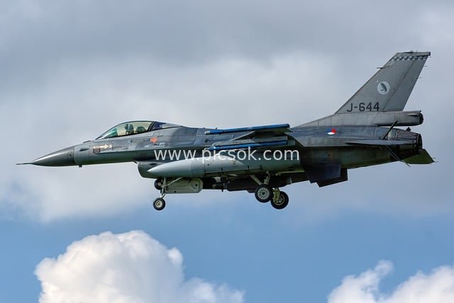 F-16 Fighter Jet Soaring in the Blue Sky