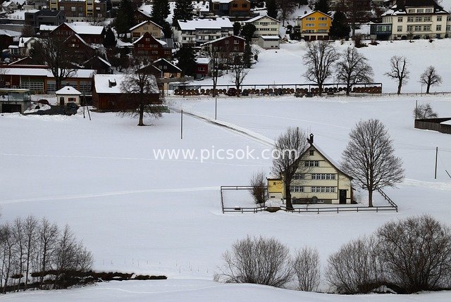 Alpine Mountain Village in Winter: Peaceful Snow-Covered Landscape