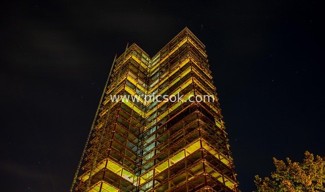 Skyscraper Under Night Construction – Illuminated Renovation Night View