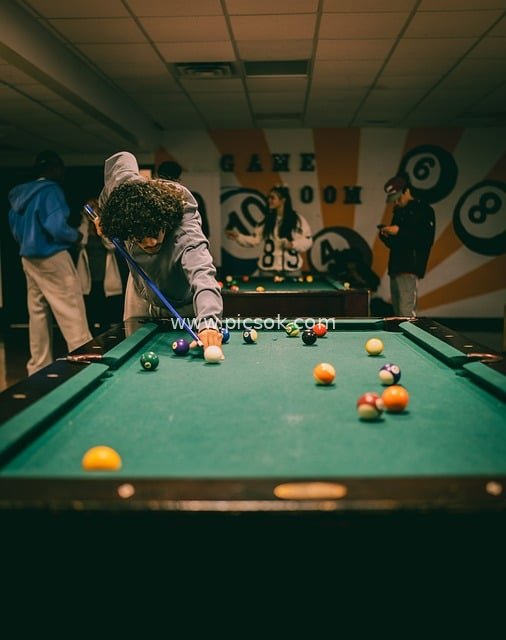 8-Ball Billiards Match in University Game Room: A Leisurely Competitive Scene