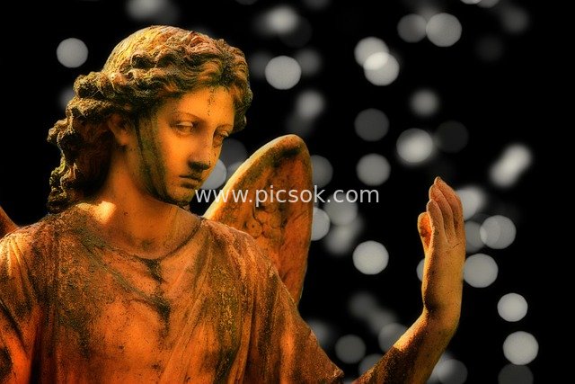 Christmas Angel Sculpture | Warm-Toned Bokeh Religious Art Material