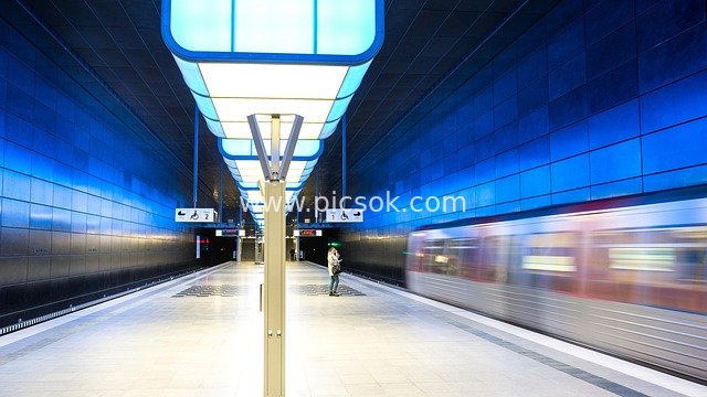 Modern Subway Station in Hamburg Hafencity: Rapid Train Under Blue Lighting