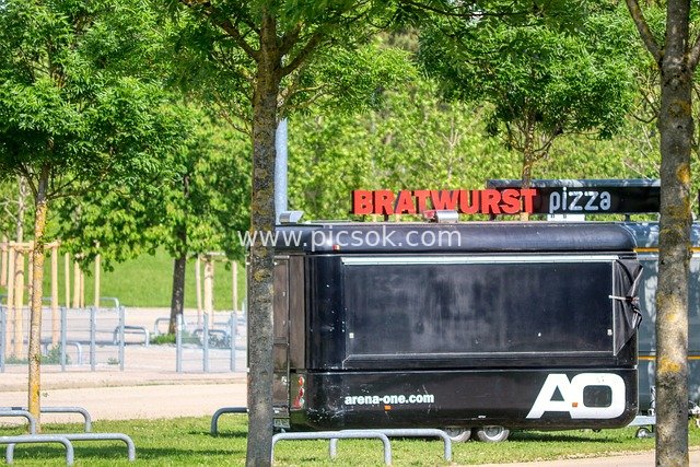 Black BRATWURST Pizza Food Truck in Park Recreation Area
