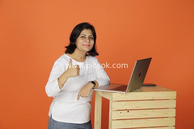 Indian Professional Woman in Business Office: Work Scene with Smile and Thumbs-Up