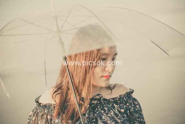 Woman in Floral Dress with Transparent Umbrella by Misty Sea | Dreamy Retro Portrait