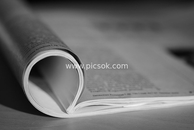 Black and White Macro Close-Up: Flipping Newspaper Pages & Reading Texture