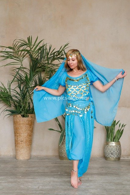 Indoor Dance Portrait of a Young Woman in Oriental-Style Belly Dance Costume