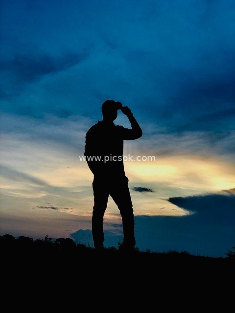 Silhouette of a Figure Under the Dusk Sky - Inspirational Background Material